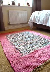 Dhurrie rug, recycled material pink border, 100x150cm