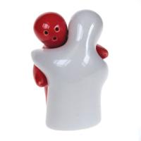 Salt and pepper pots hugging red and white
