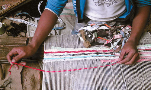 Asha making rag rugs