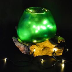 Shaped green bowl on wood, recycled glass approx 17-21cm