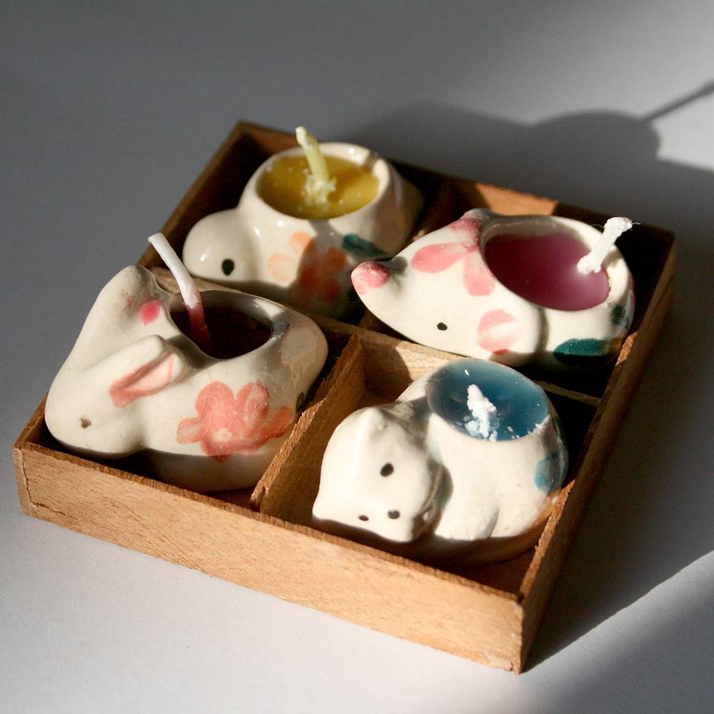Pack of 4 mini candles in animal holders